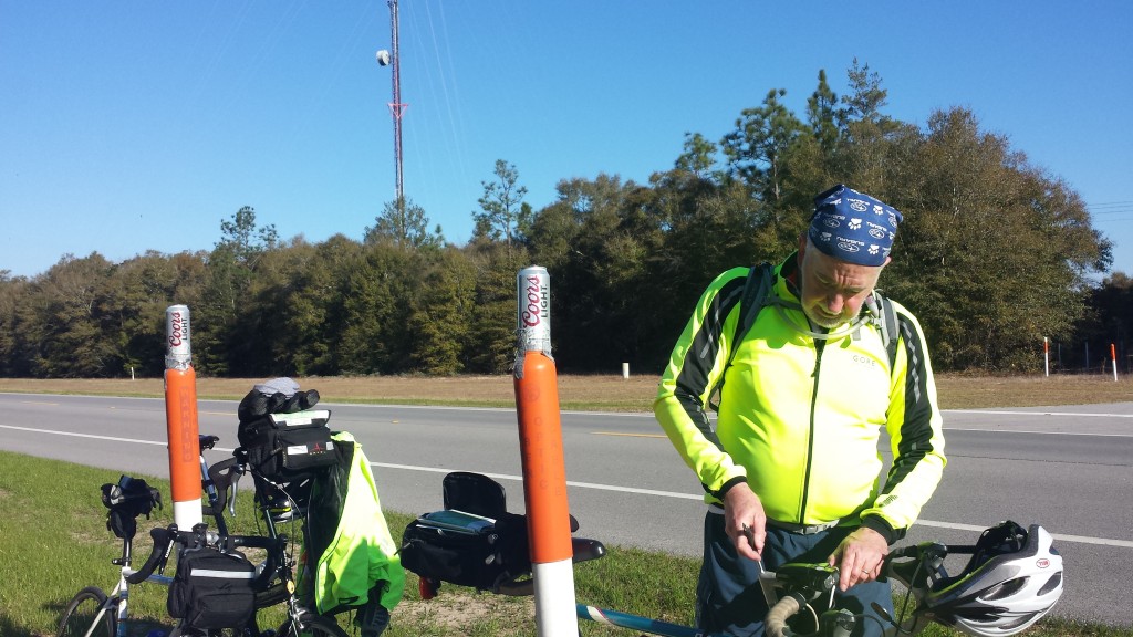 Tim at our first stop of the day at Mossy Head, FL on S 90. Notice the Coors Light beer cans ducktaped to the orange gas line markers. 