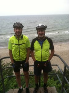 Brian and Tim in Germany with the Baltic Sea in the background.